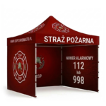 Czerwony namiot ekspresowy Straż Pożarna OSP Stare Miasto z logo na dachu i ścianach oraz numerami alarmowymi 112 i 998.